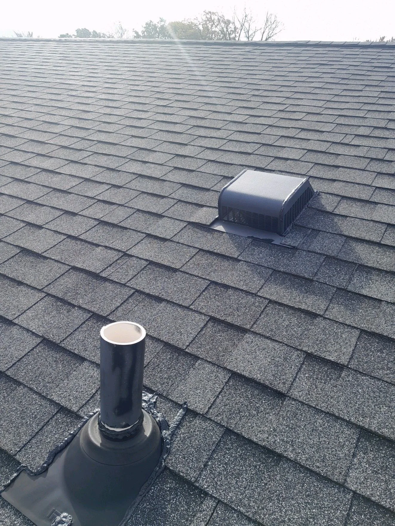 Roof vents on an apartment building roof serviced by Crown